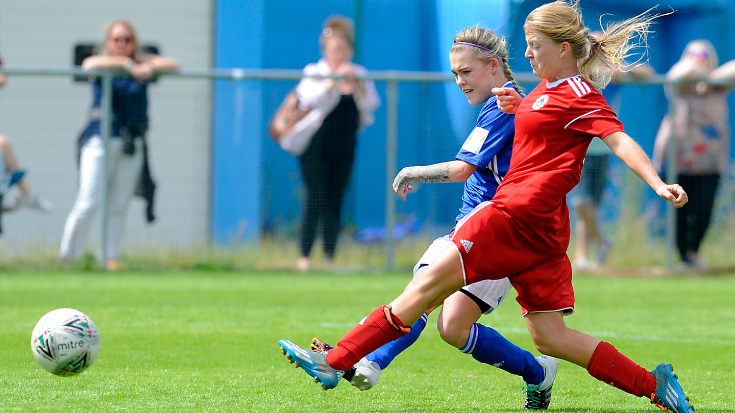 Cardiff City Women in home kit.